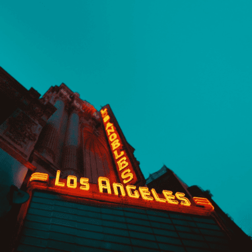 Los Angeles Light Up Neon Sign. Yellow letters with orange outline horizontal and vertically written,